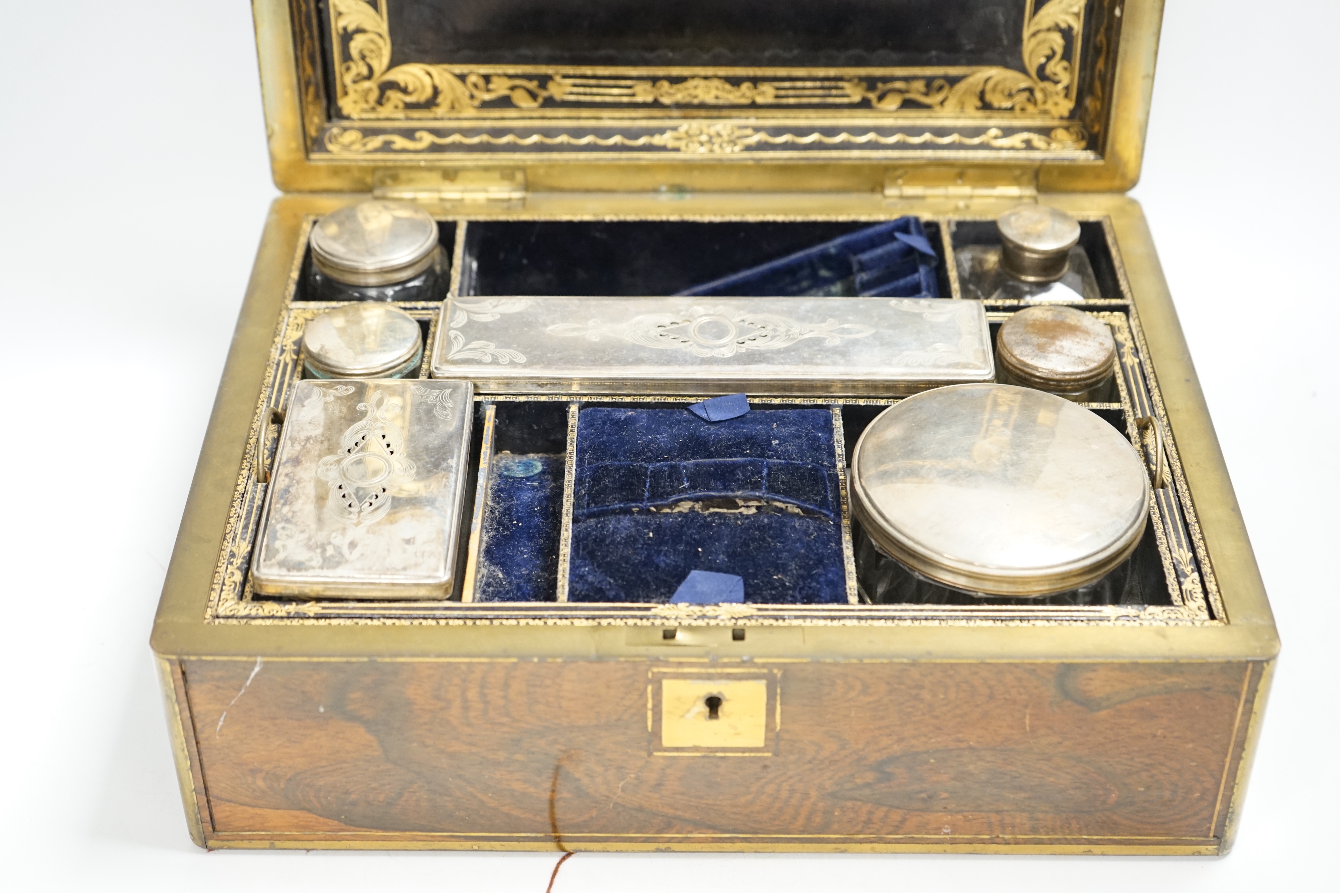 A Victorian rosewood brass bound toilet box, with silver plate mounted bottles and Amber and Jet beads box, 31.5cm wide x 14cm high